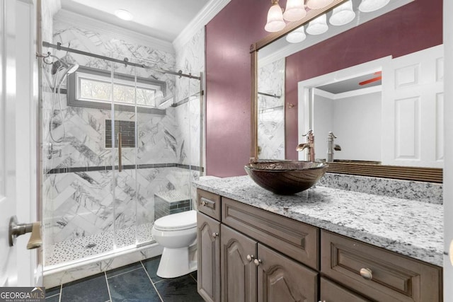 full bathroom featuring vanity, a marble finish shower, ornamental molding, and toilet
