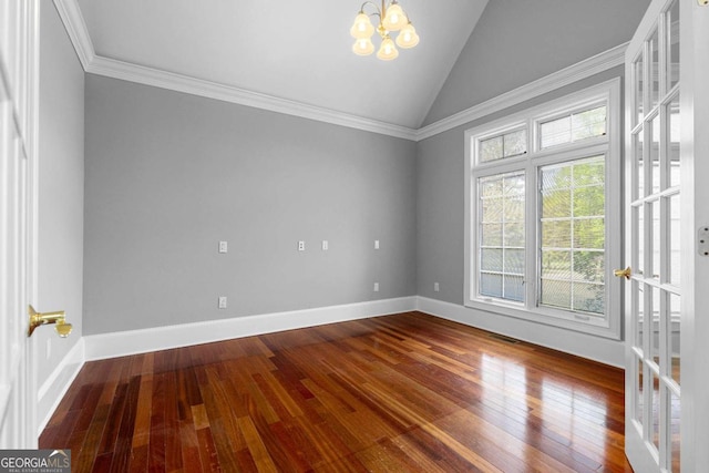 spare room featuring baseboards, vaulted ceiling, a chandelier, crown molding, and wood-type flooring