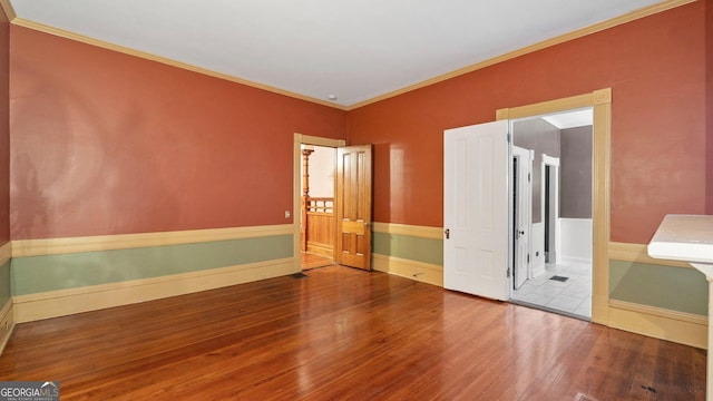 316 E 3rd Ave, Rome, GA 30161 - unfurnished bedroom featuring wood finished floors, ornamental molding, and baseboards