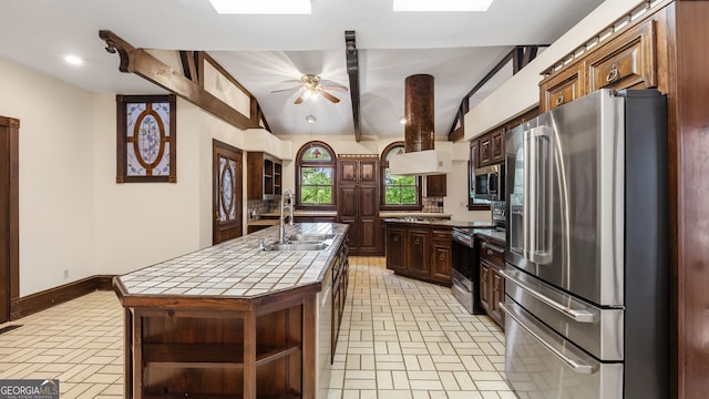 316 E 3rd Ave, Rome, GA 30161 - kitchen featuring appliances with stainless steel finishes, tile counters, a sink, and brick patterned floors