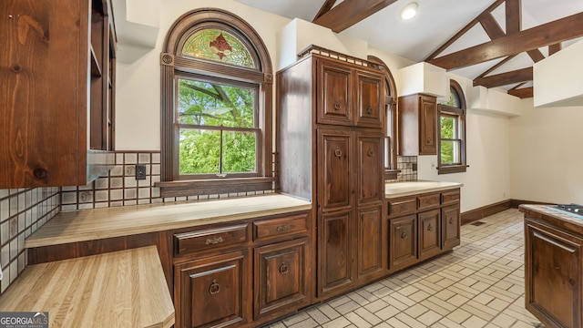 316 E 3rd Ave, Rome, GA 30161 - kitchen featuring tasteful backsplash, plenty of natural light, high vaulted ceiling, brick patterned floors, and beamed ceiling