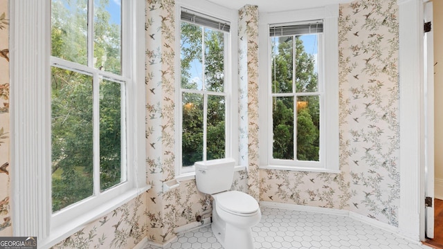 316 E 3rd Ave, Rome, GA 30161 - bathroom featuring tile patterned flooring, toilet, baseboards, and wallpapered walls
