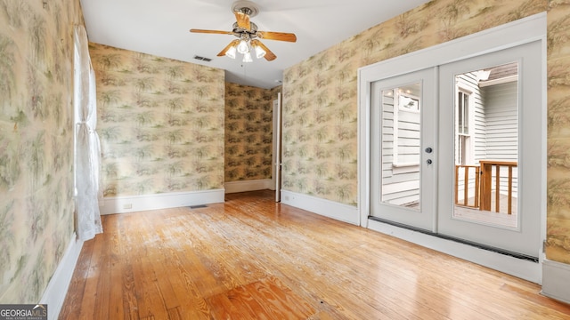 316 E 3rd Ave, Rome, GA 30161 - unfurnished room with wallpapered walls, wood-type flooring, ceiling fan, and baseboards