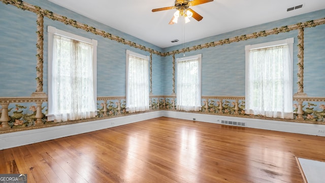 316 E 3rd Ave, Rome, GA 30161 - spare room with wallpapered walls, ceiling fan, and hardwood / wood-style floors