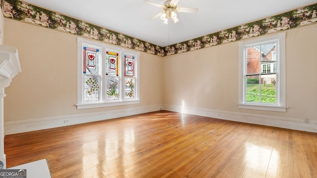316 E 3rd Ave, Rome, GA 30161 - spare room featuring wood-type flooring, baseboards, and ceiling fan