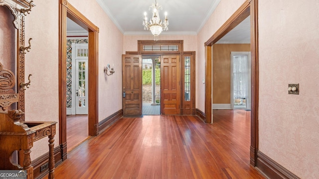 316 E 3rd Ave, Rome, GA 30161 - foyer featuring hardwood / wood-style flooring, a chandelier, baseboards, and ornamental molding