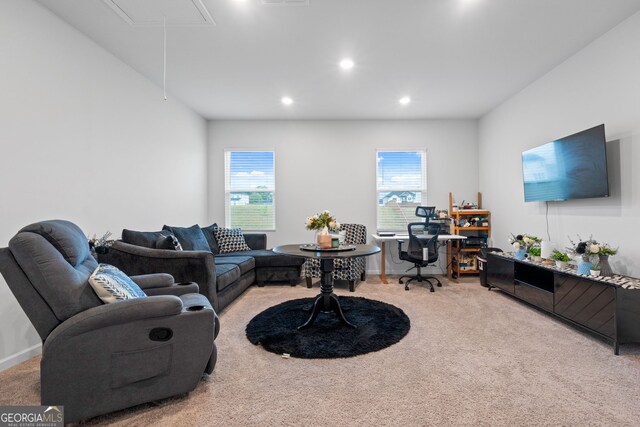 living area featuring attic access, baseboards, carpet, and recessed lighting