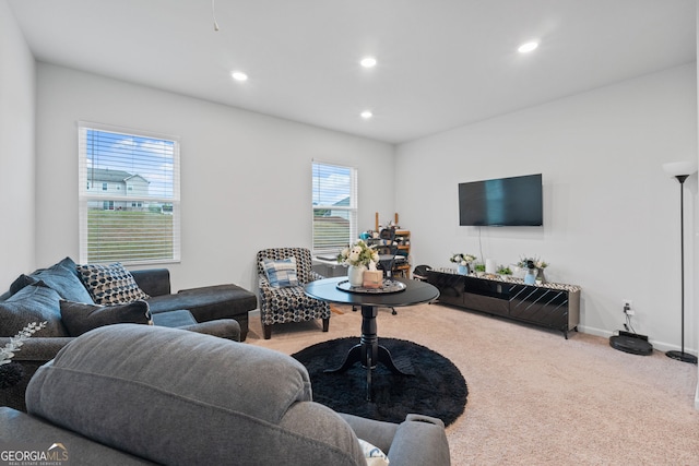 living area featuring carpet flooring, baseboards, and recessed lighting