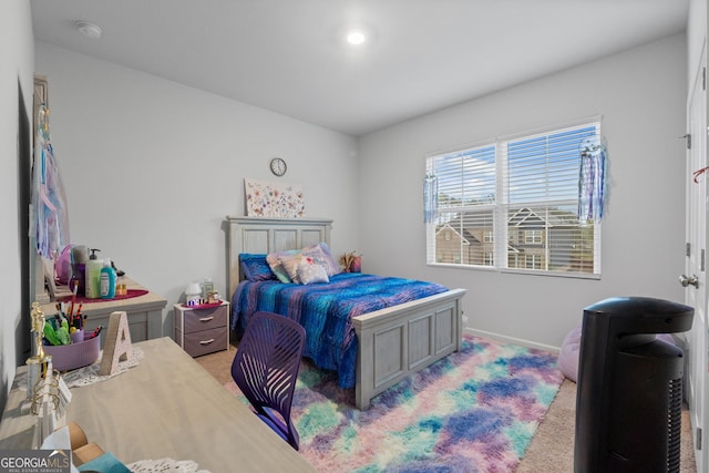 bedroom with carpet flooring and baseboards