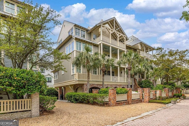 17 Sea Oats Ln, Saint Simons, GA 31522 - view of front of home with brick siding and a balcony
