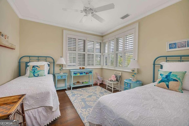 17 Sea Oats Ln, Saint Simons, GA 31522 - bedroom featuring crown molding, visible vents, a ceiling fan, and wood finished floors