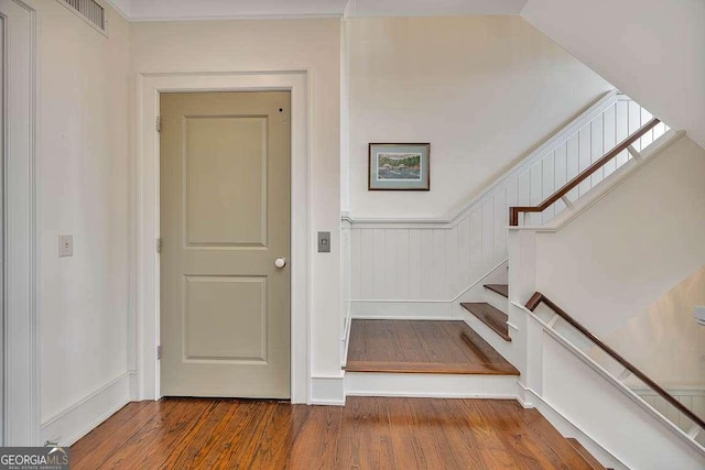 17 Sea Oats Ln, Saint Simons, GA 31522 - stairs featuring visible vents and wood finished floors