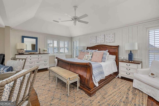 17 Sea Oats Ln, Saint Simons, GA 31522 - bedroom featuring wood finished floors, vaulted ceiling, multiple windows, and visible vents