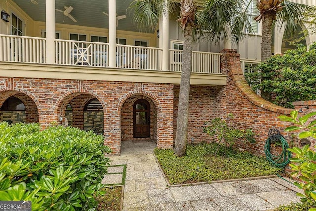 17 Sea Oats Ln, Saint Simons, GA 31522 - property entrance with brick siding and a balcony