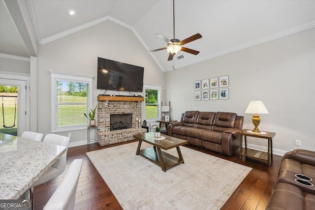 41 Laurel Rdg, Forsyth, GA 31029 - living area with a ceiling fan, dark wood finished floors, healthy amount of natural light, a fireplace, and high vaulted ceiling
