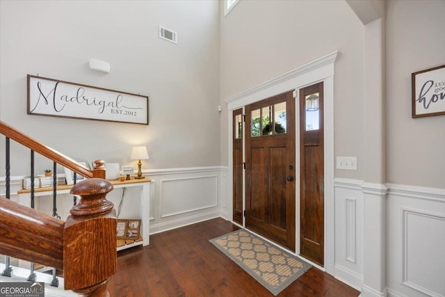 41 Laurel Rdg, Forsyth, GA 31029 - foyer with wood finished floors, wainscoting, a decorative wall, and stairway