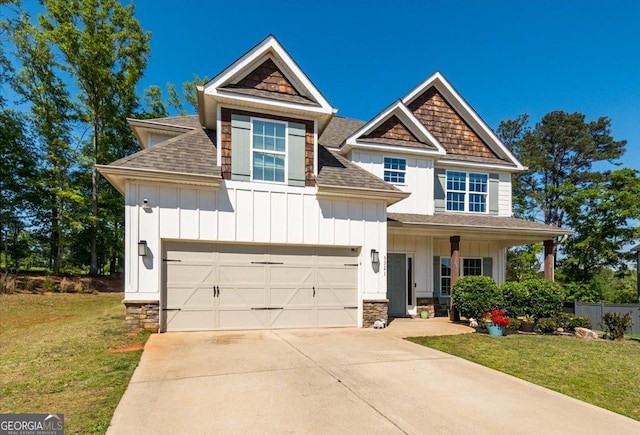 5321 Felles Way, Forsyth, GA 31029 - craftsman-style house featuring board and batten siding, a shingled roof, a garage, and concrete driveway