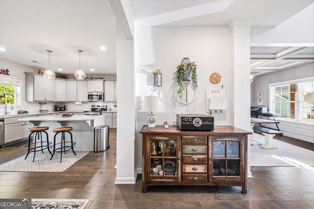 5321 Felles Way, Forsyth, GA 31029 - bar area with appliances with stainless steel finishes, recessed lighting, beamed ceiling, hanging light fixtures, and coffered ceiling