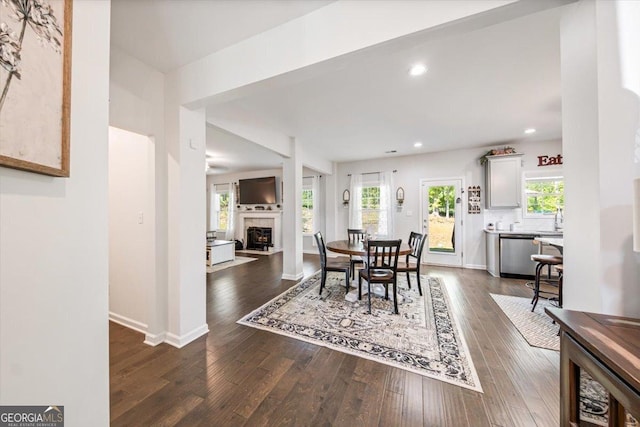 5321 Felles Way, Forsyth, GA 31029 - dining room with dark wood-type flooring, recessed lighting, and a tile fireplace
