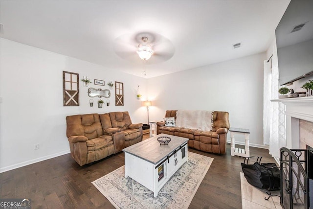 5321 Felles Way, Forsyth, GA 31029 - living room with ceiling fan, dark wood finished floors, and a fireplace