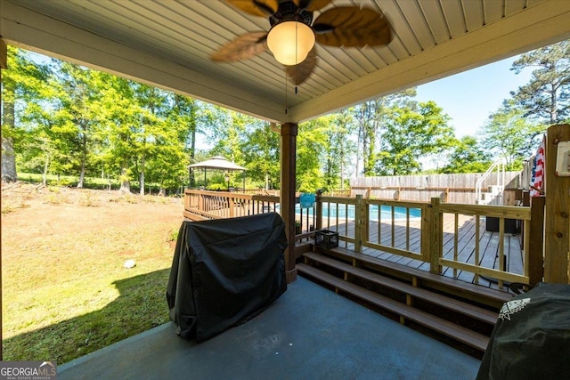 5321 Felles Way, Forsyth, GA 31029 - fenced backyard featuring a wooden deck and ceiling fan