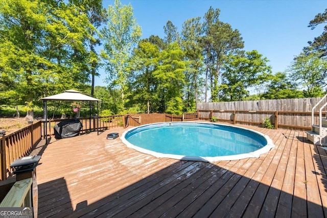 5321 Felles Way, Forsyth, GA 31029 - view of swimming pool with a gazebo, a deck, and a fenced backyard
