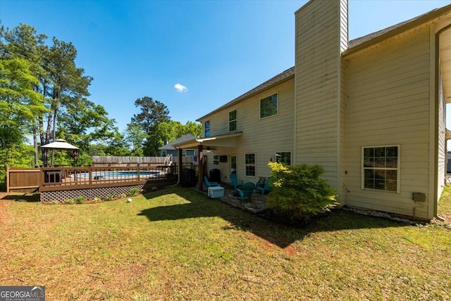 5321 Felles Way, Forsyth, GA 31029 - view of green lawn with a wooden deck and ceiling fan
