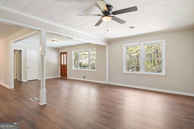 2125 Perkerson Mill Rd, Austell, GA 30106 - unfurnished living room with dark wood-type flooring, crown molding, baseboards, and a ceiling fan