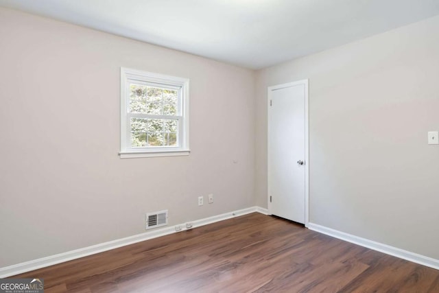 2125 Perkerson Mill Rd, Austell, GA 30106 - spare room with baseboards, dark wood finished floors, and visible vents
