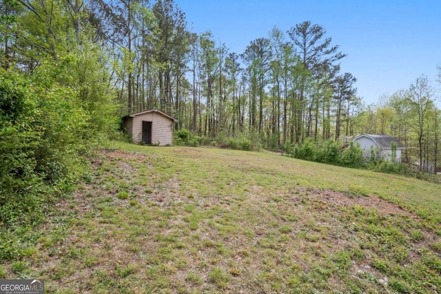 2125 Perkerson Mill Rd, Austell, GA 30106 - view of yard with an outbuilding and a shed