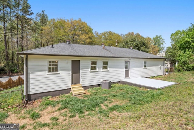 2125 Perkerson Mill Rd, Austell, GA 30106 - back of property featuring roof with shingles, entry steps, central AC, fence, and a lawn