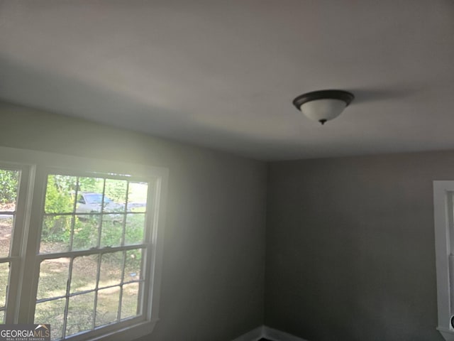 empty room featuring plenty of natural light