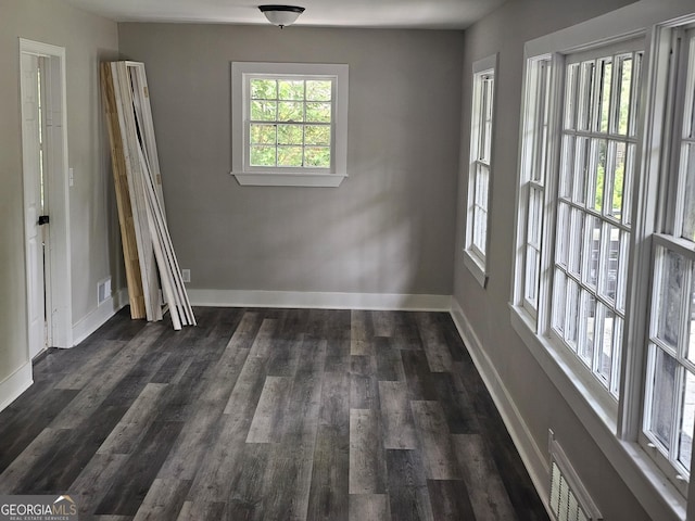 1956 Shirley St SW, Atlanta, GA 30311 - spare room with baseboards and dark wood-type flooring