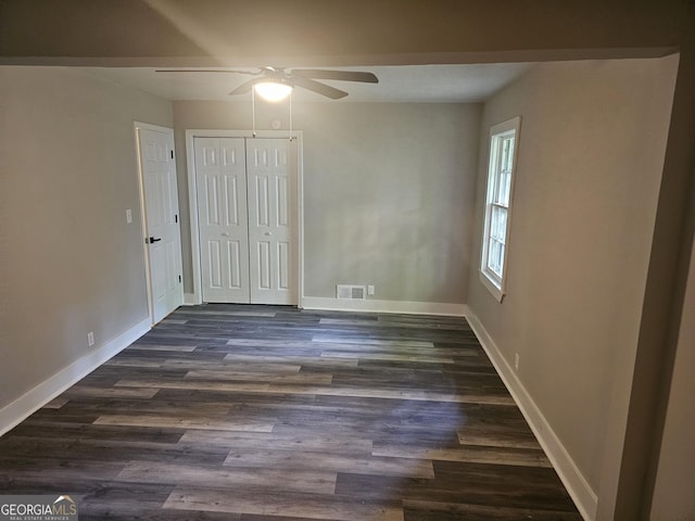 1956 Shirley St SW, Atlanta, GA 30311 - unfurnished bedroom with dark wood finished floors, baseboards, a closet, and ceiling fan