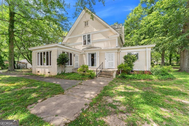 209 Westminster Hwy, Westminster, SC 29693 - view of front of property with brick siding, crawl space, and a front yard