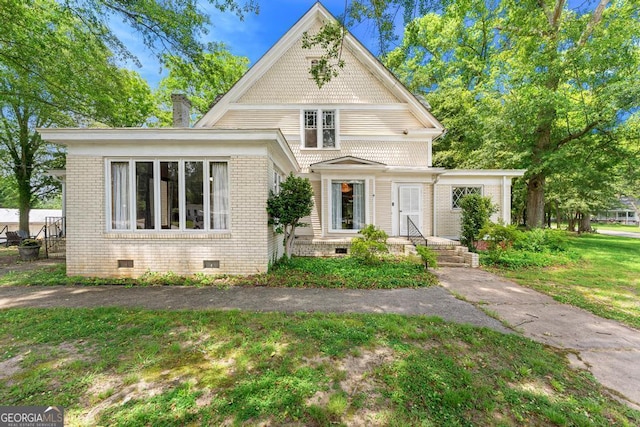 209 Westminster Hwy, Westminster, SC 29693 - victorian house featuring crawl space, brick siding, a front yard, and a chimney
