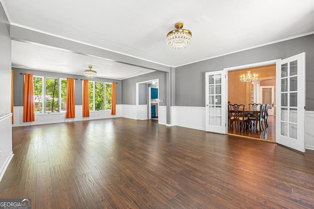 209 Westminster Hwy, Westminster, SC 29693 - unfurnished living room with a chandelier, french doors, wood finished floors, wainscoting, and ornamental molding