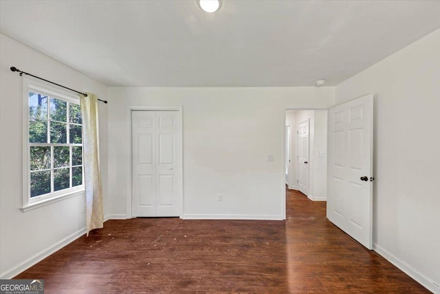 856 Glenway Dr, East Point, GA 30344 - unfurnished bedroom with baseboards, multiple windows, and wood finished floors