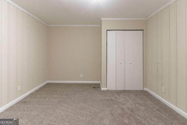 2062 Whites Mill Rd, Decatur, GA 30032 - unfurnished bedroom featuring baseboards, a closet, carpet flooring, crown molding, and visible vents