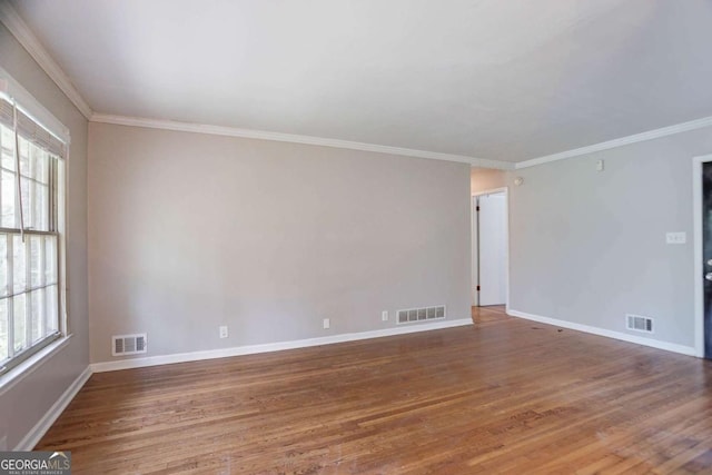 empty room featuring visible vents and a wealth of natural light