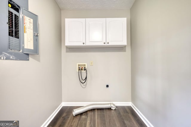 laundry room featuring baseboards, electric panel, washer hookup, hookup for an electric dryer, and cabinet space