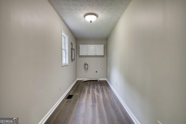 laundry area with a textured ceiling, visible vents, washer hookup, dark wood-style flooring, and baseboards
