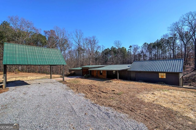 290 Mount Moriah Rd, Dallas, GA 30132 - exterior space featuring metal roof and driveway