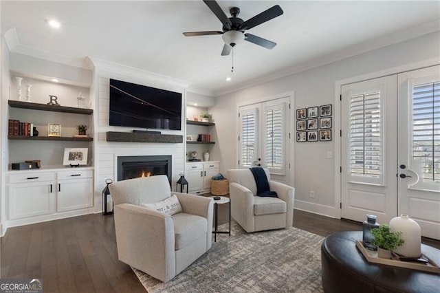 825 Maplewood Dr, Roswell, GA 30075 - living area featuring crown molding, french doors, ceiling fan, and dark wood-style floors