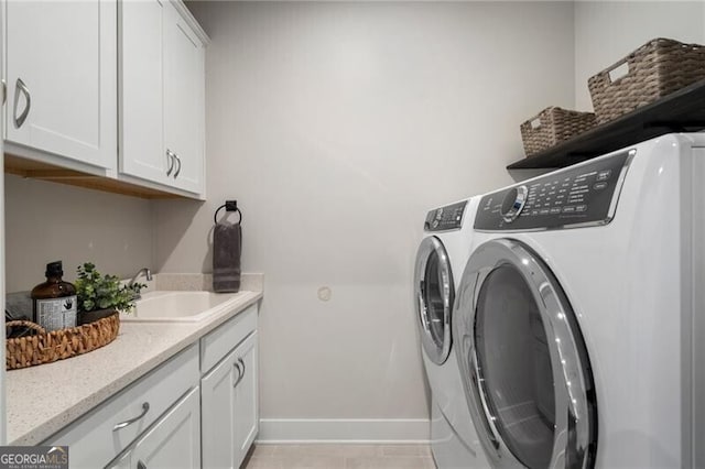 825 Maplewood Dr, Roswell, GA 30075 - clothes washing area with separate washer and dryer, baseboards, a sink, and cabinet space