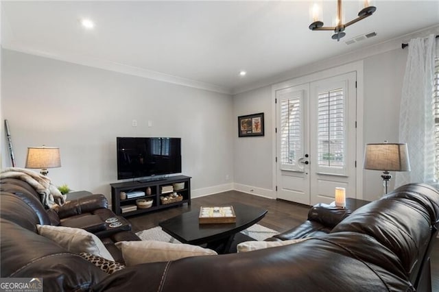 825 Maplewood Dr, Roswell, GA 30075 - living area with crown molding, visible vents, dark wood-style flooring, french doors, and baseboards