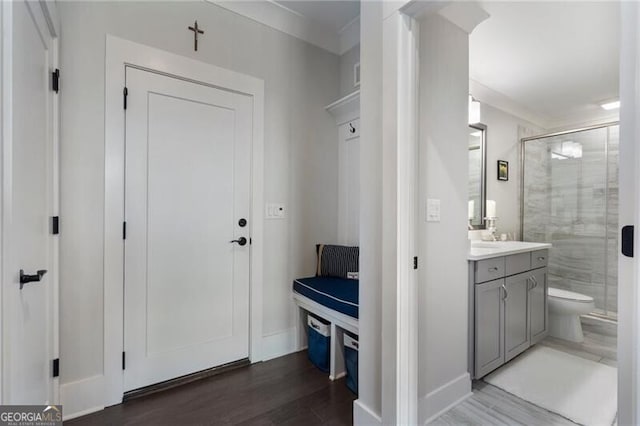 825 Maplewood Dr, Roswell, GA 30075 - bathroom with baseboards, toilet, a shower stall, vanity, and wood finished floors
