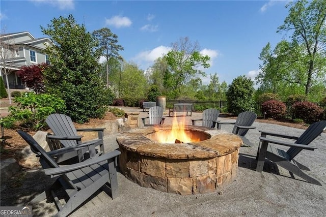 825 Maplewood Dr, Roswell, GA 30075 - view of patio with an outdoor fire pit and fence