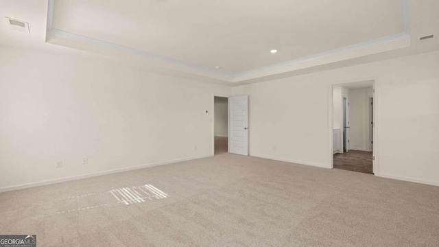 1139 Blue Juniper Cir, Loganville, GA 30052 - carpeted empty room featuring baseboards, ornamental molding, recessed lighting, visible vents, and a tray ceiling
