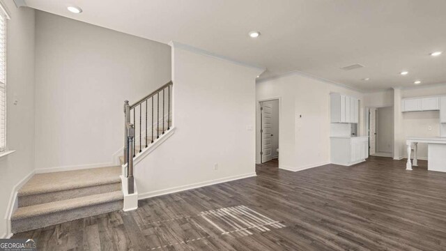 1139 Blue Juniper Cir, Loganville, GA 30052 - unfurnished living room with recessed lighting, stairs, dark wood-style flooring, and baseboards